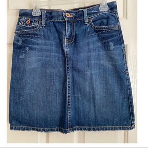 Blue jean skirt with floral backside pockets